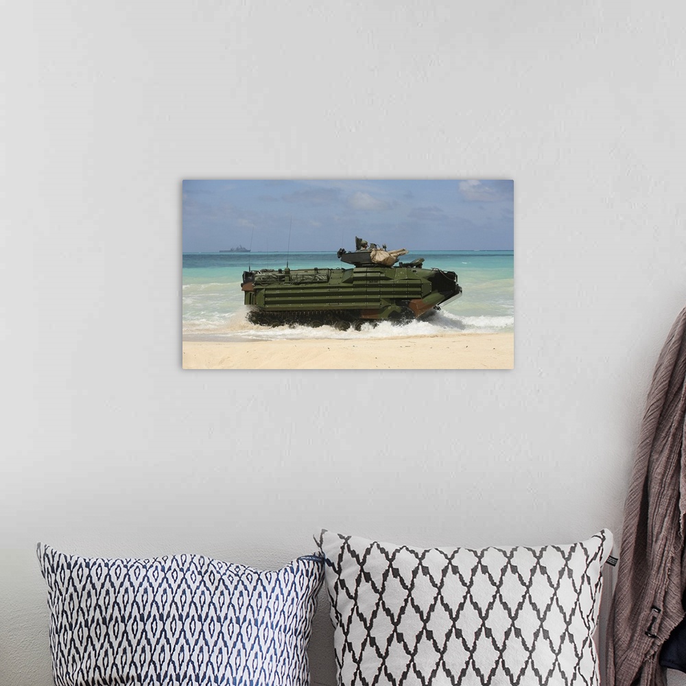 A bohemian room featuring Marines drive an Amphibious Assault Vehicle on the beach of Hawaii.