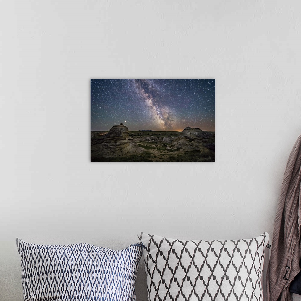 A bohemian room featuring Mars and the galactic center of Milky Way over Writing-on-Stone Provincial Park, Canada.