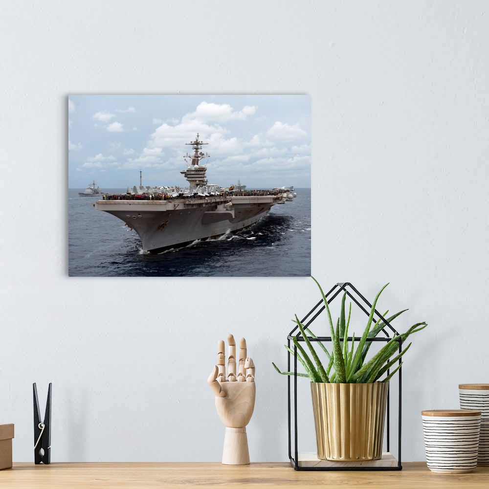 A bohemian room featuring Nimitz class aircraft carrier USS Carl Vinson transits the Bay of Bengal.