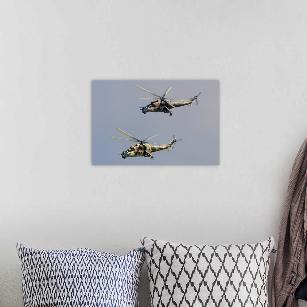 A bohemian room featuring Pair of Mil Mi-24P attack helicopters of Russian Air Force.