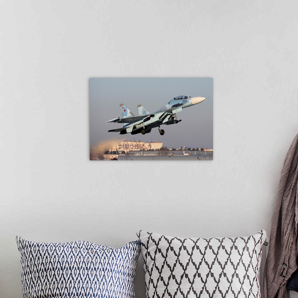 A bohemian room featuring Su-30M2 jet fighter of Russian Air Force taking off, Zhukovsky, Russia.