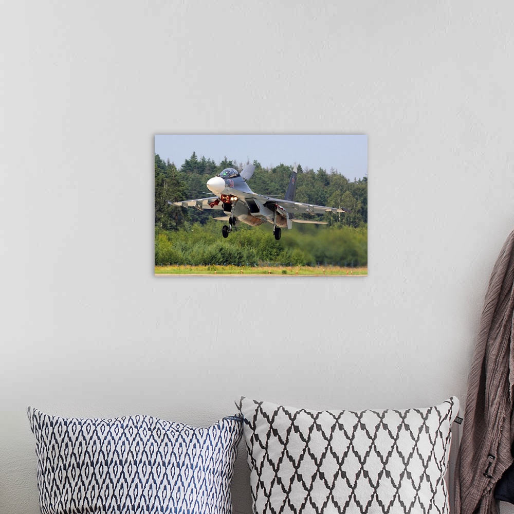 A bohemian room featuring Su-30SM jet fighter of Russian Air Force landing, Kubinka, Russia.