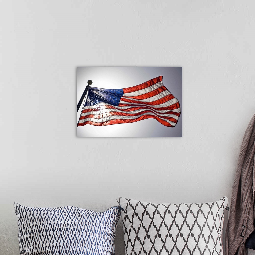 A bohemian room featuring The American flag flies prominently.