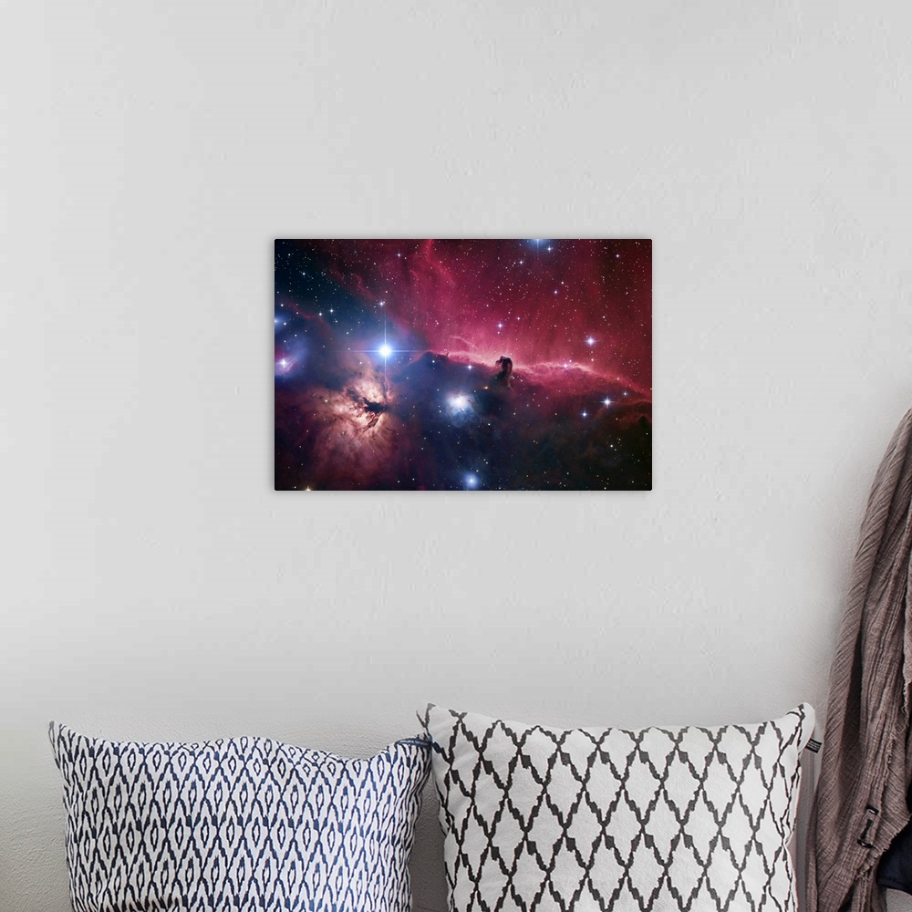 A bohemian room featuring Large photograph displays an open part of space filled with stars and focusing on aodark cloud of...