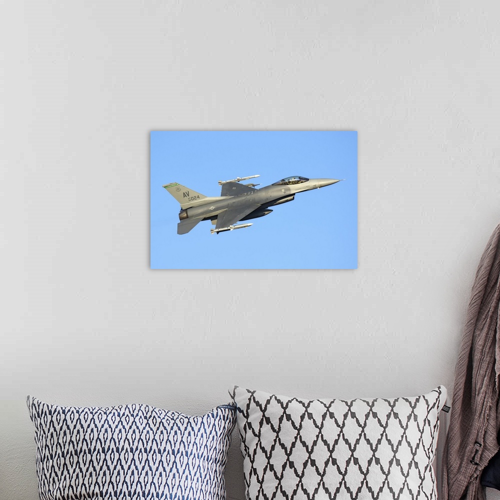 A bohemian room featuring U.S. Air Force F-16C Block 40 of the 555th Fighter Squadron, 31st Operations Group, takes off fro...