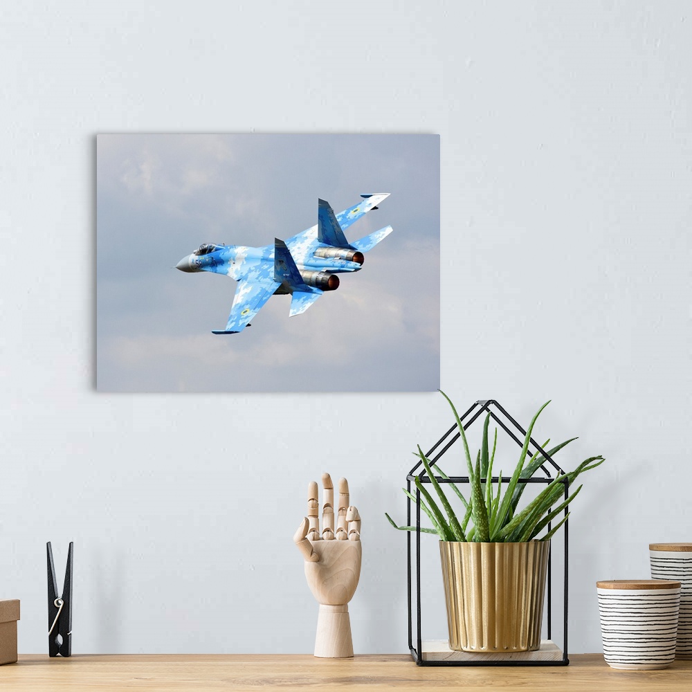A bohemian room featuring Ukraine Air Force Su-27 taking off.