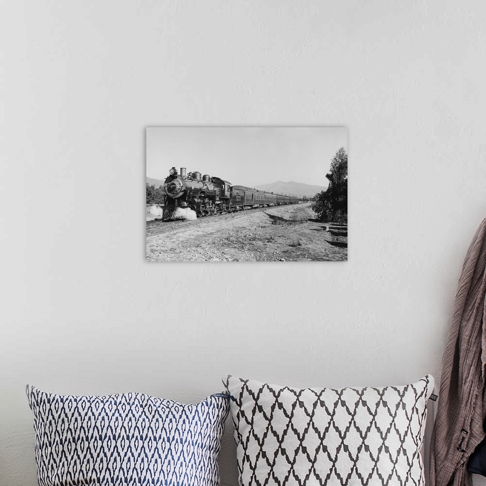 A bohemian room featuring Vintage photo of a passenger train speeding down the tracks.