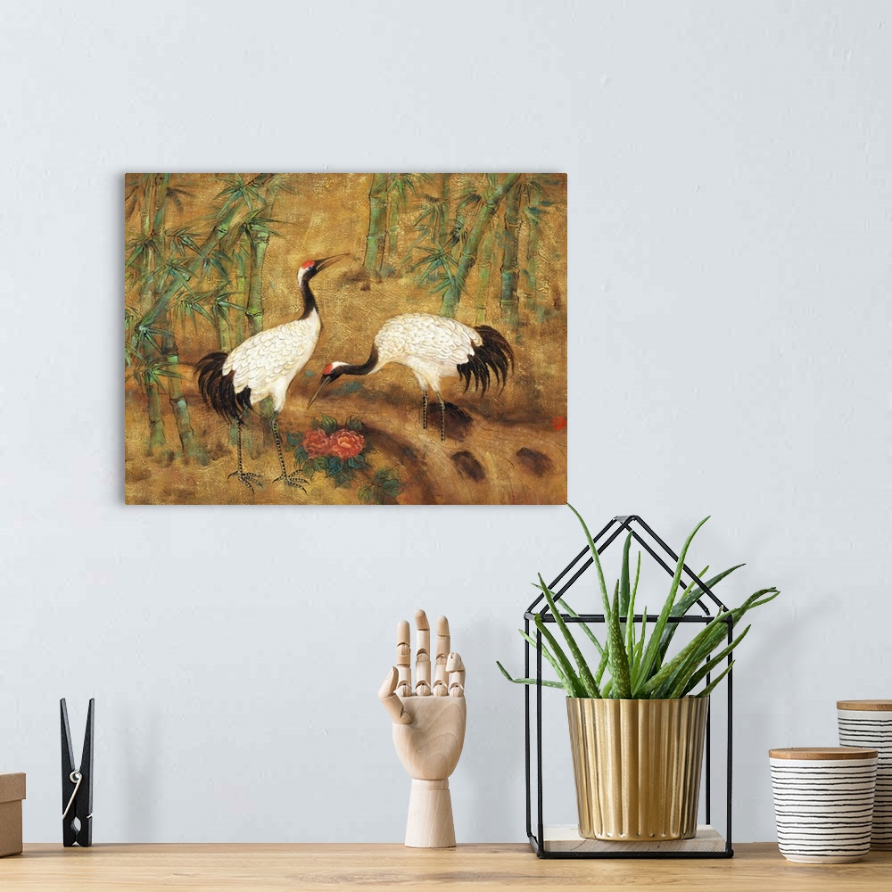 A bohemian room featuring Asian style painting of two cranes foraging in bamboo.