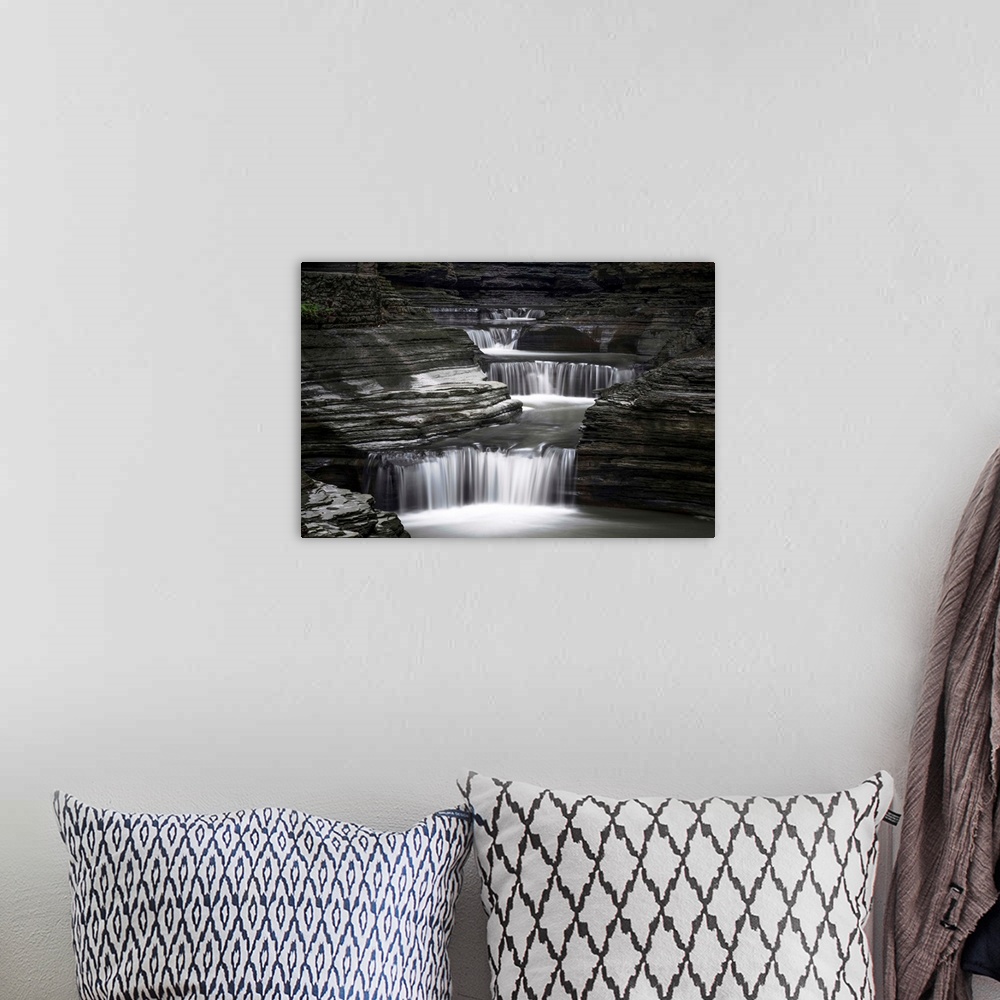 A bohemian room featuring Black and white image of a rushing waterfall in upstate New York.