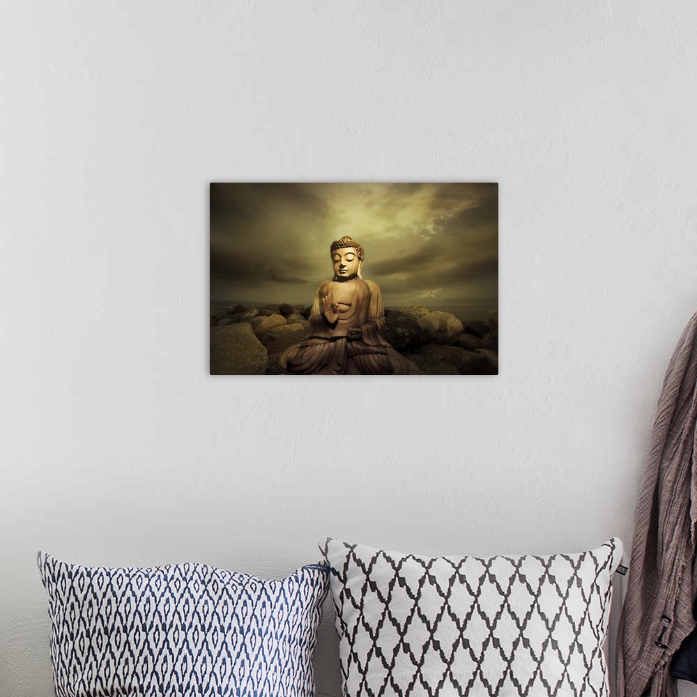 A bohemian room featuring A bhudda on a rocky shore
