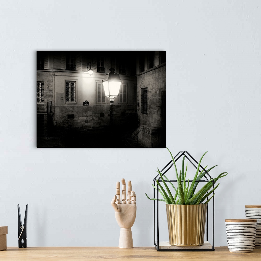 A bohemian room featuring Paris back street at night with street light