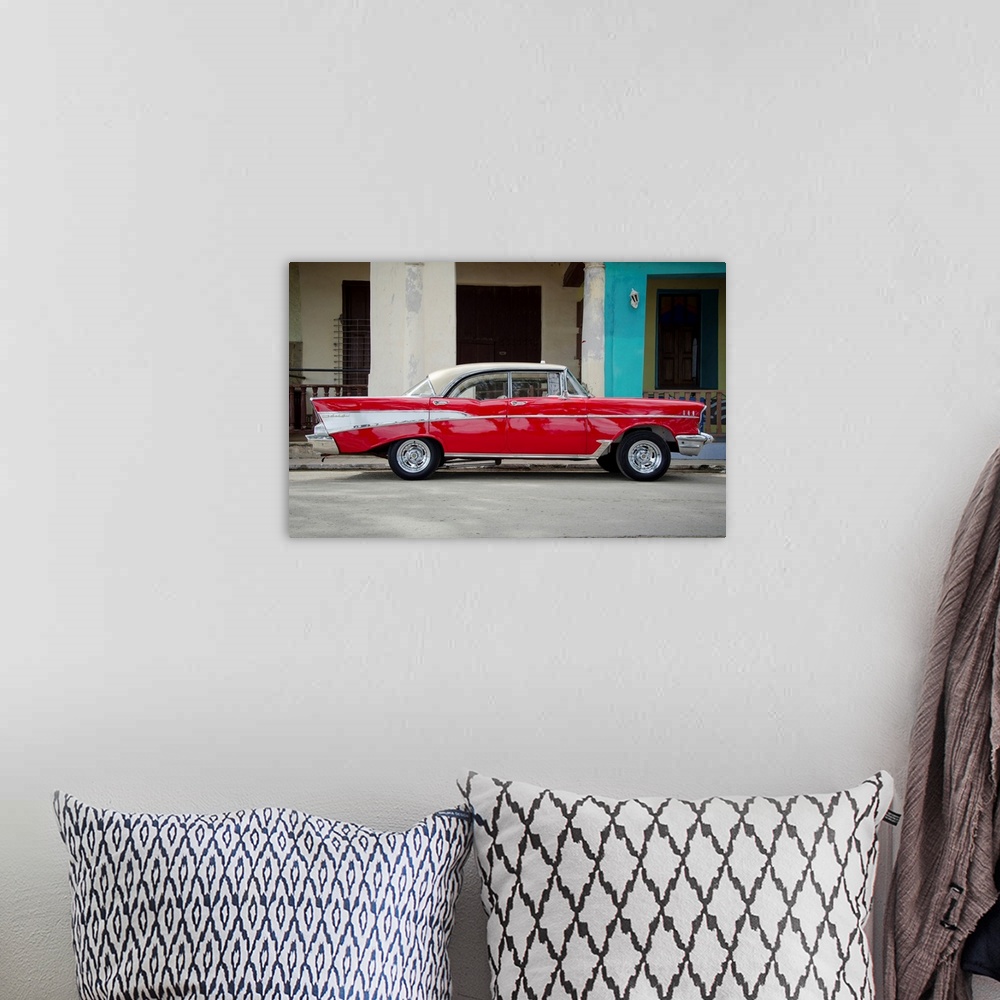 A bohemian room featuring A photograph of a colorful vintage car in Cuba.