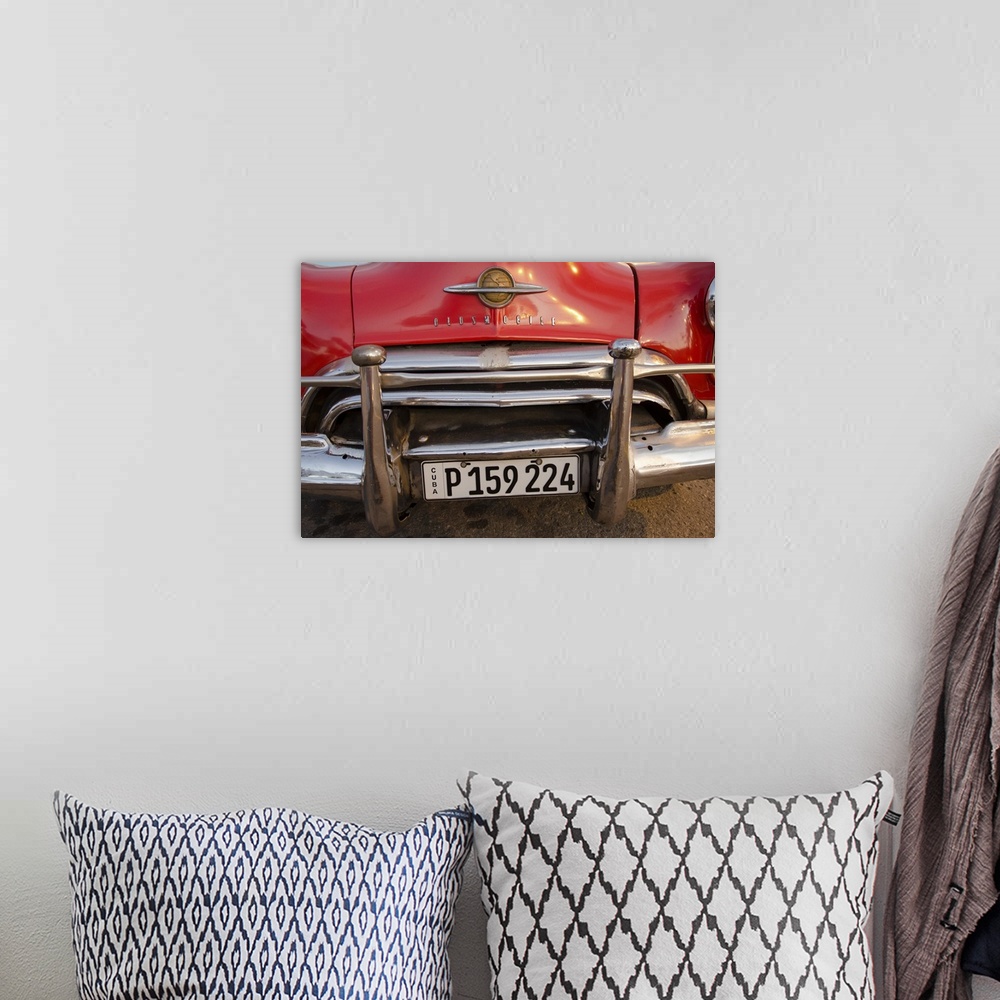 A bohemian room featuring A photograph of a colorful vintage car in Cuba.