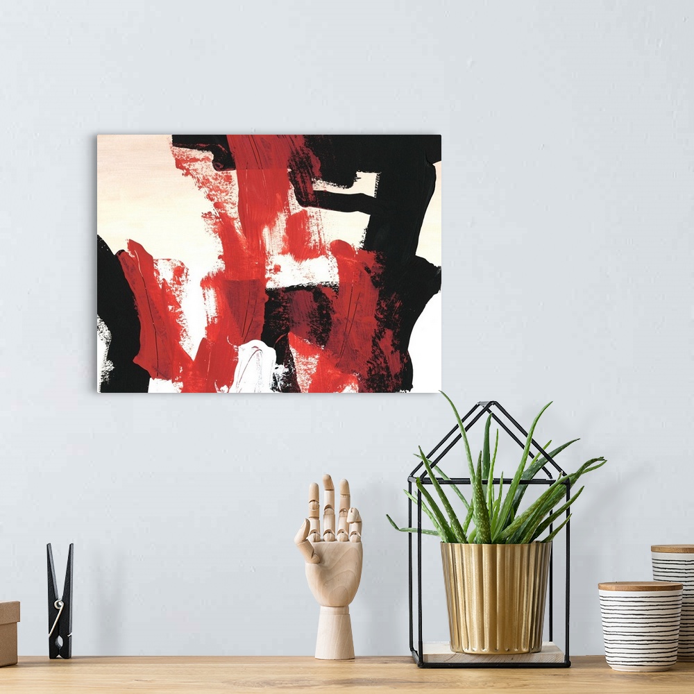A bohemian room featuring Bold abstract painting in red, white, and black, with broad brushstrokes.
