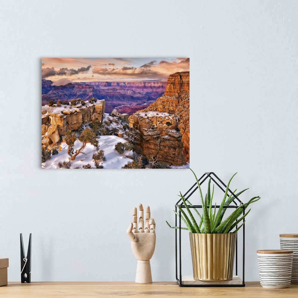 A bohemian room featuring Vista of the Grand Canyon in Arizona on a cloudy day under a blanket of snow.