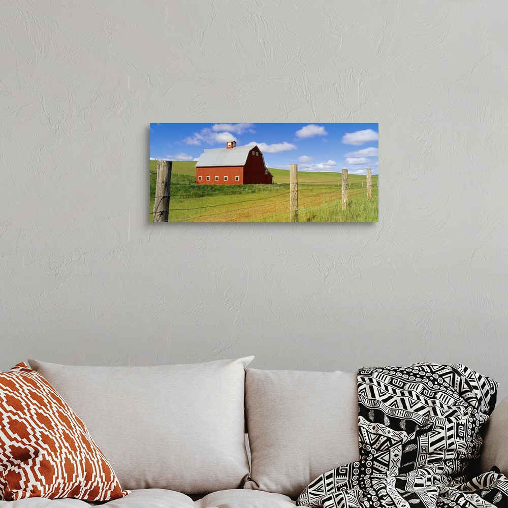 A bohemian room featuring Barn in a field