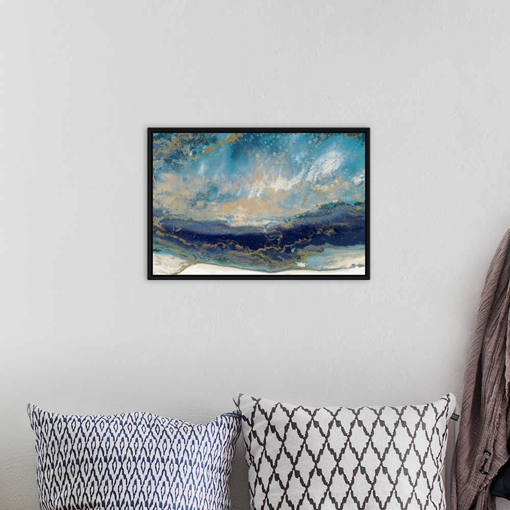 A bohemian room featuring Contemporary abstract artwork in blue and gold, resembling a seascape.