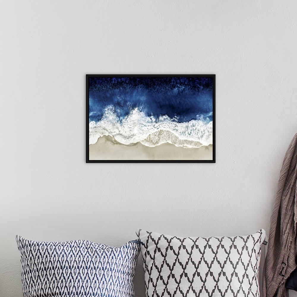 A bohemian room featuring One artwork in a series of aerial shots of a beach as dark blue waves break upon the shore.