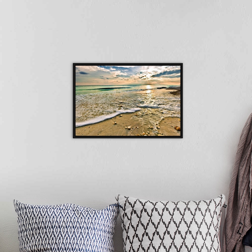 A bohemian room featuring Landscape photography of a beautiful beach sunset with a green seascape. This picture is titled S...