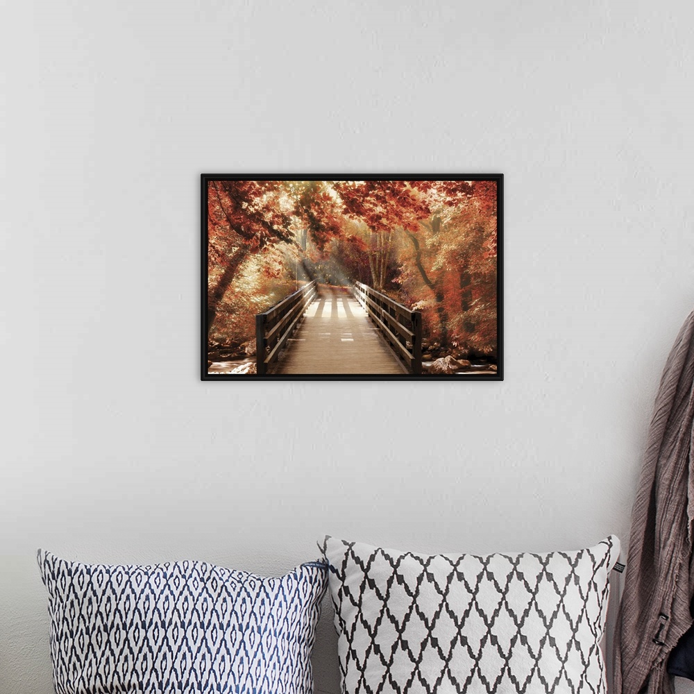 A bohemian room featuring Photograph of a bridge going over a creek in woods covered in red Fall trees with beautiful sunli...