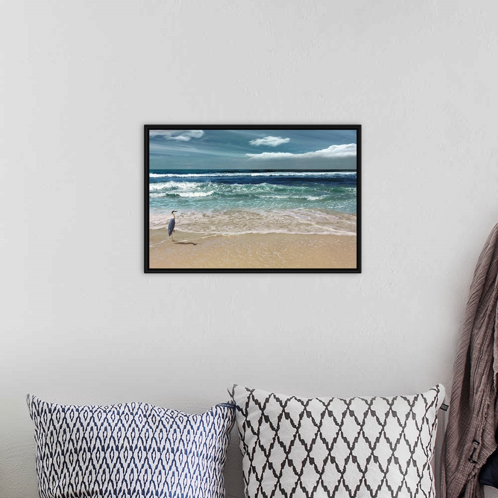 A bohemian room featuring This serene photo shows rippling waves as they approach the heron on the beach with white clouds ...