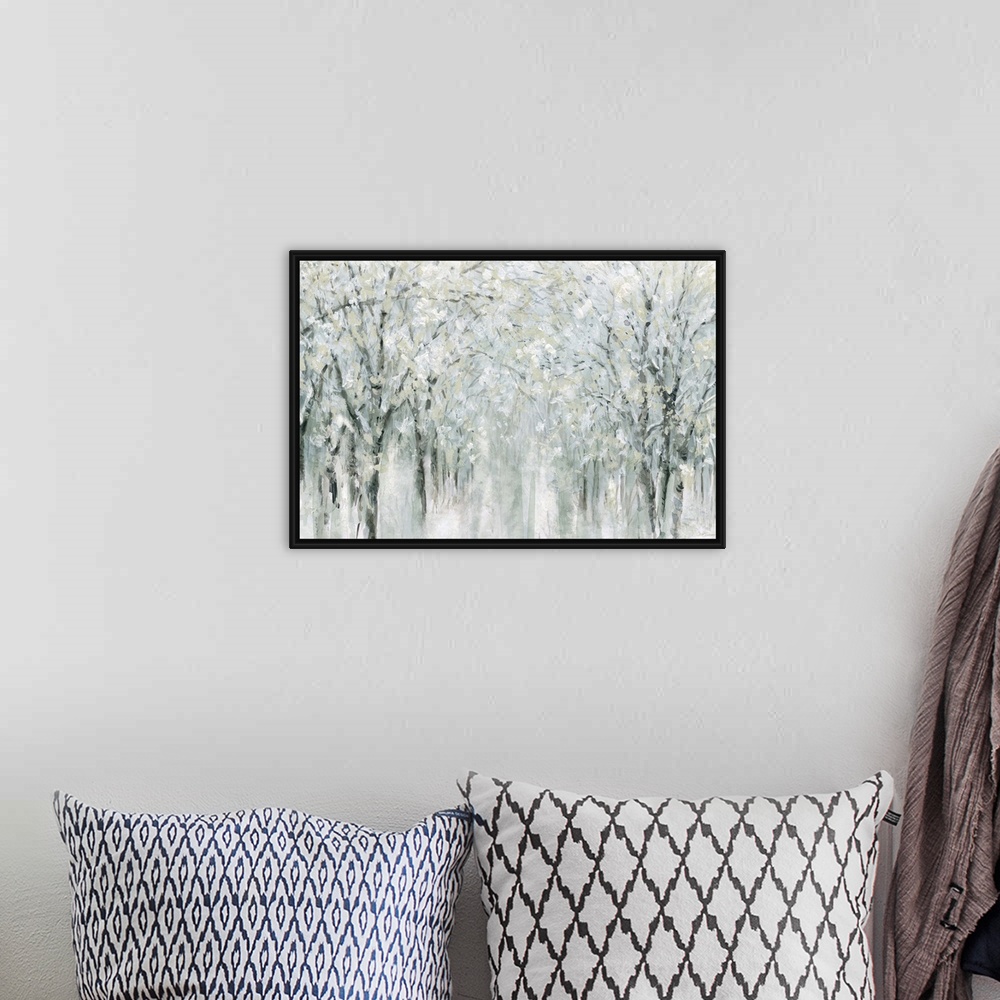 A bohemian room featuring Abstract painting of a winter scene with snow covered trees.