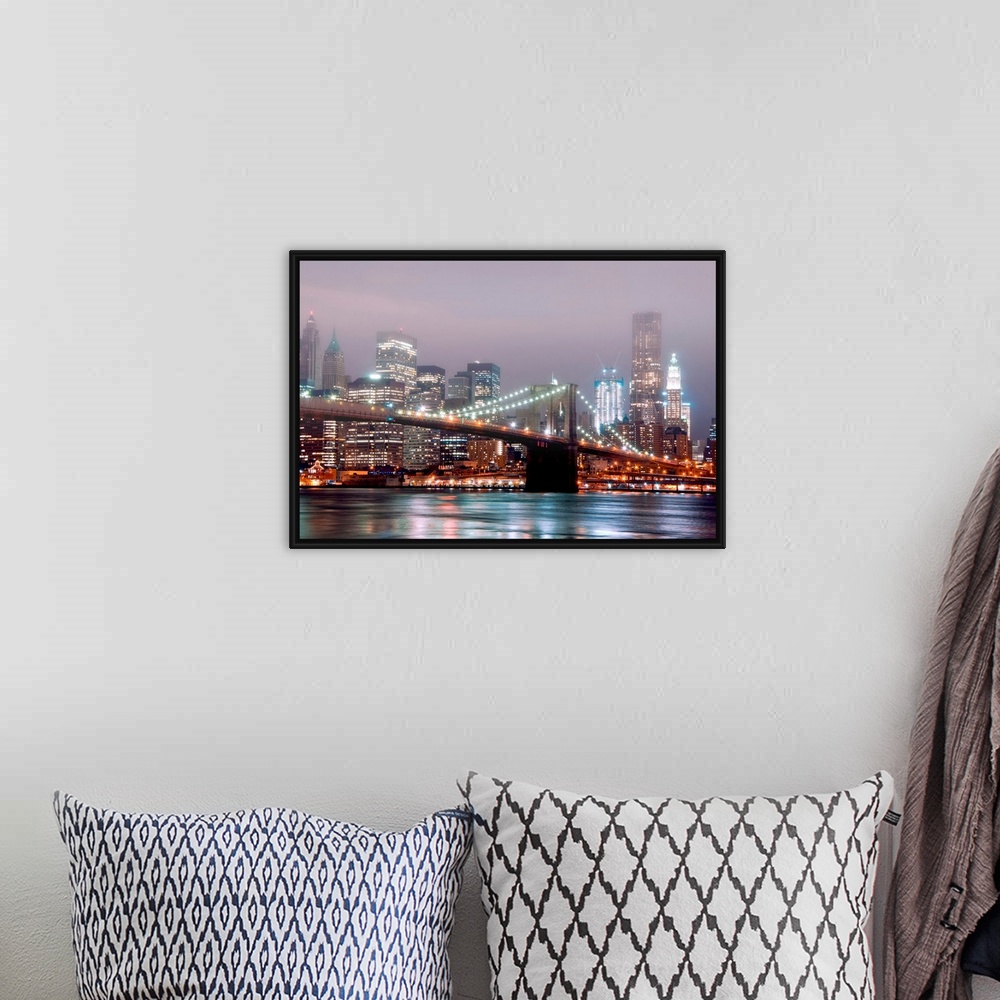 A bohemian room featuring A misty night scene illuminated by urban lights of downtown Manhattan photographed from the Brook...