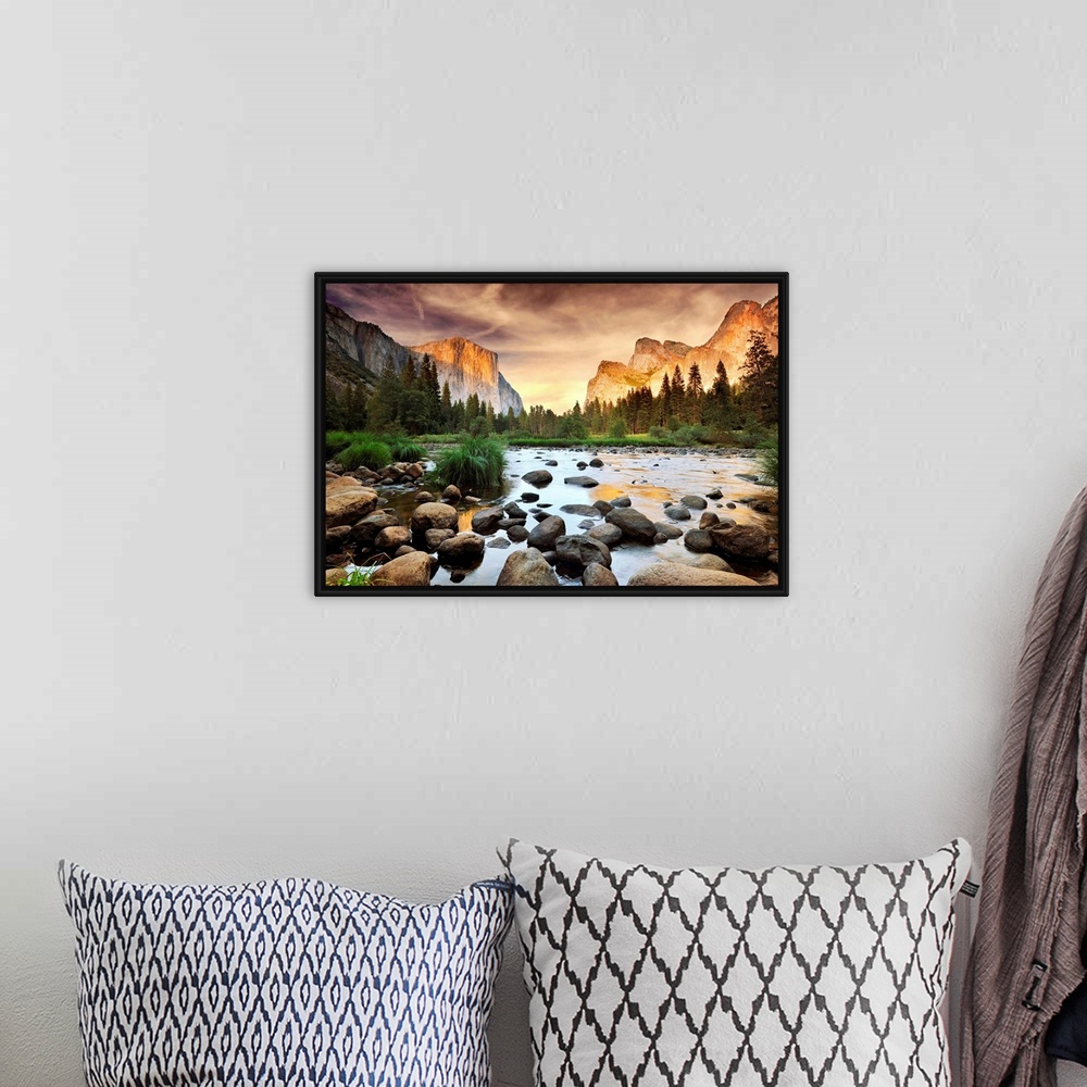 A bohemian room featuring A landscape photograph taken from the valley floor of this national park as the sun illuminates t...