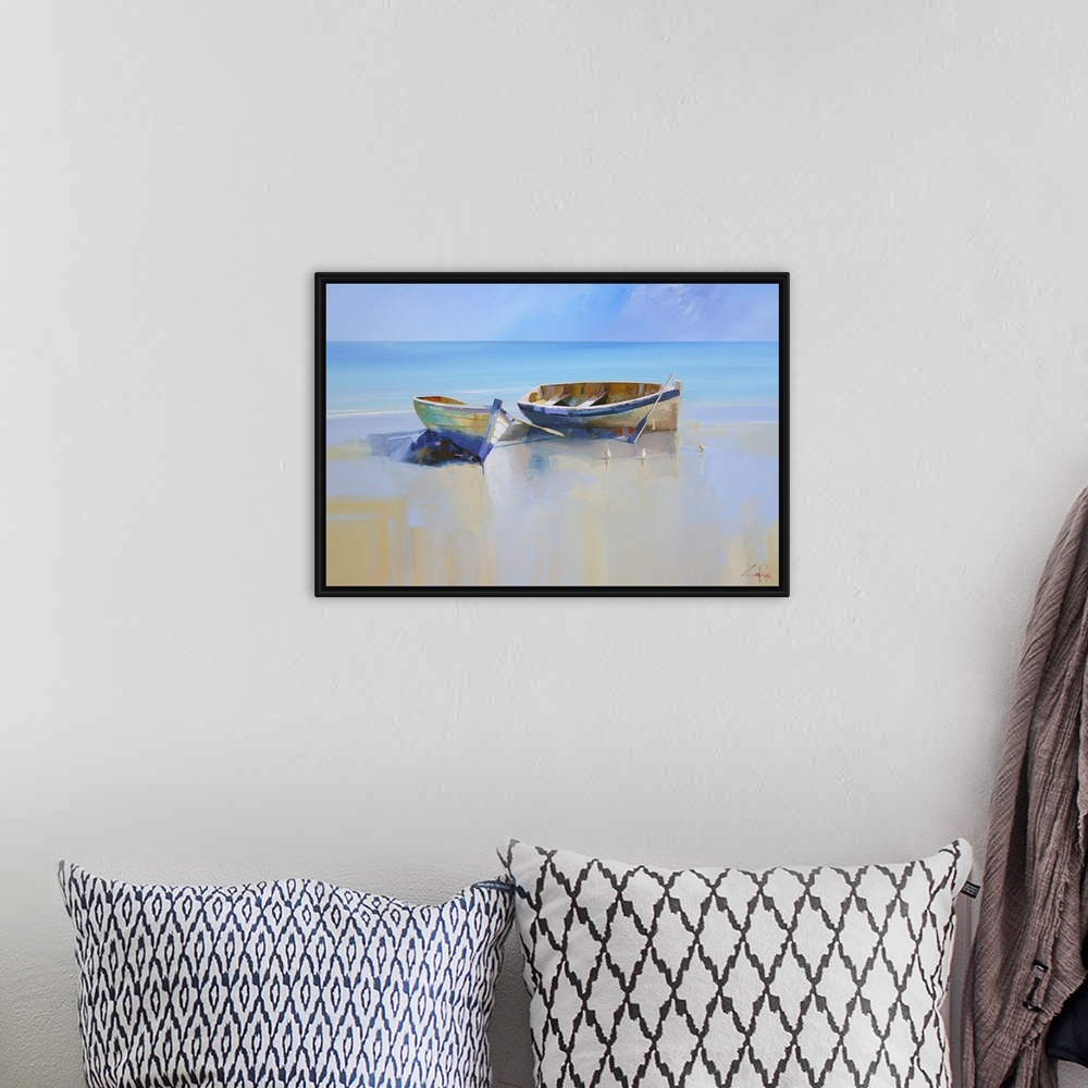A bohemian room featuring Painting of two beached rowboats at low tide.