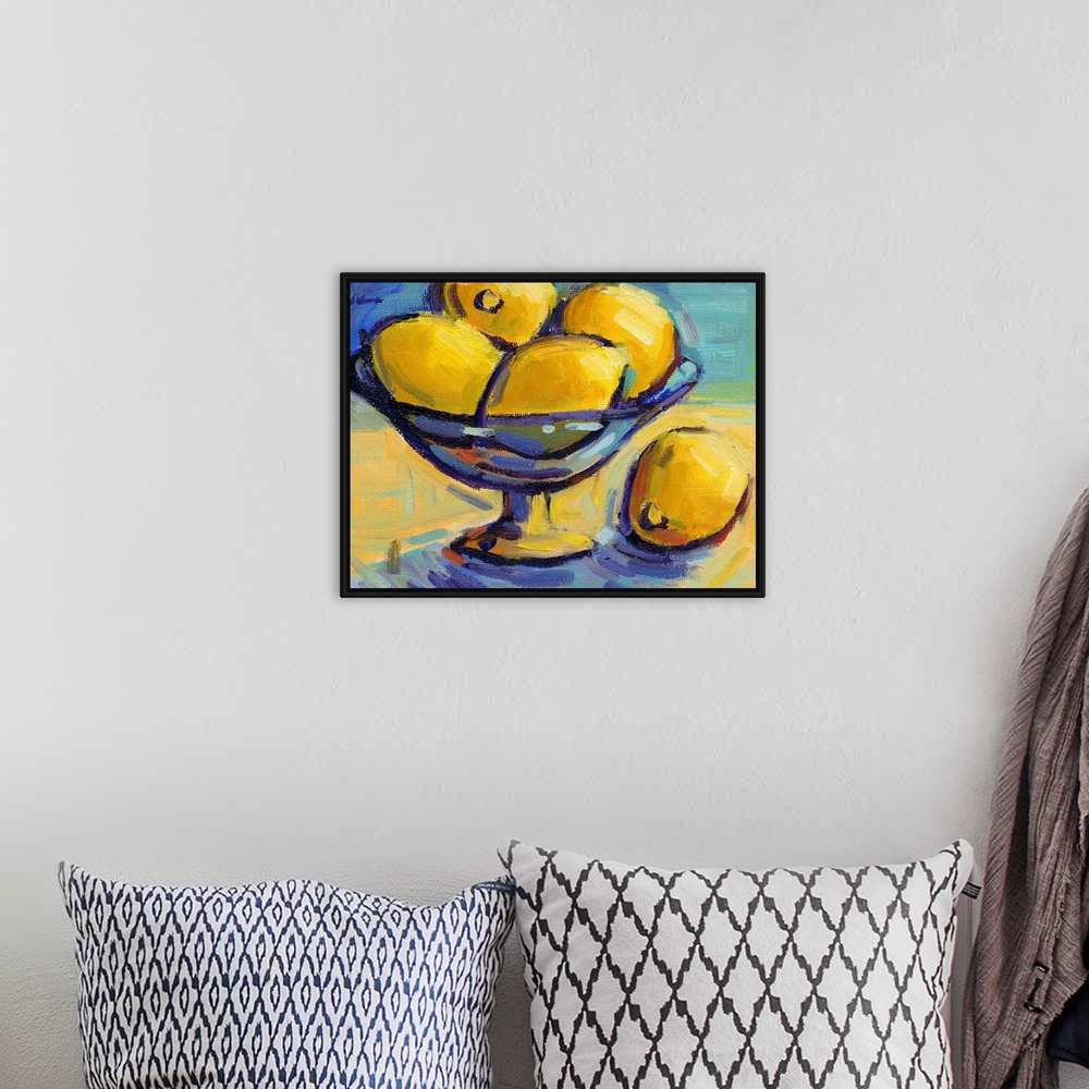 A bohemian room featuring A contemporary abstract painting of a bowl of lemons against a blue background.