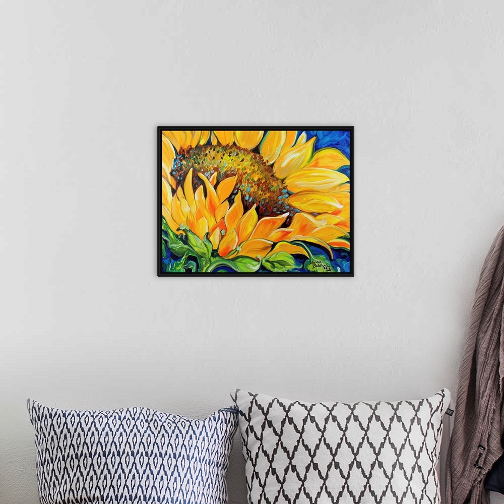 A bohemian room featuring Contemporary painting of a sunflower up close on a blue background.