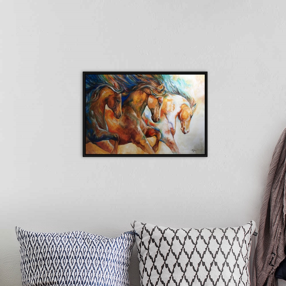 A bohemian room featuring Contemporary painting of three horses galloping in action with their mane's flowing.
