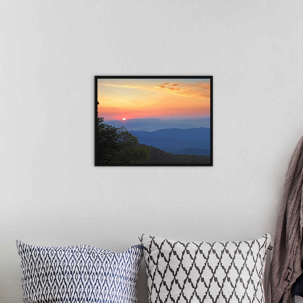 A bohemian room featuring Photo of the sun setting over the mountains from the Blue Ridge Parkway in North Carolina.