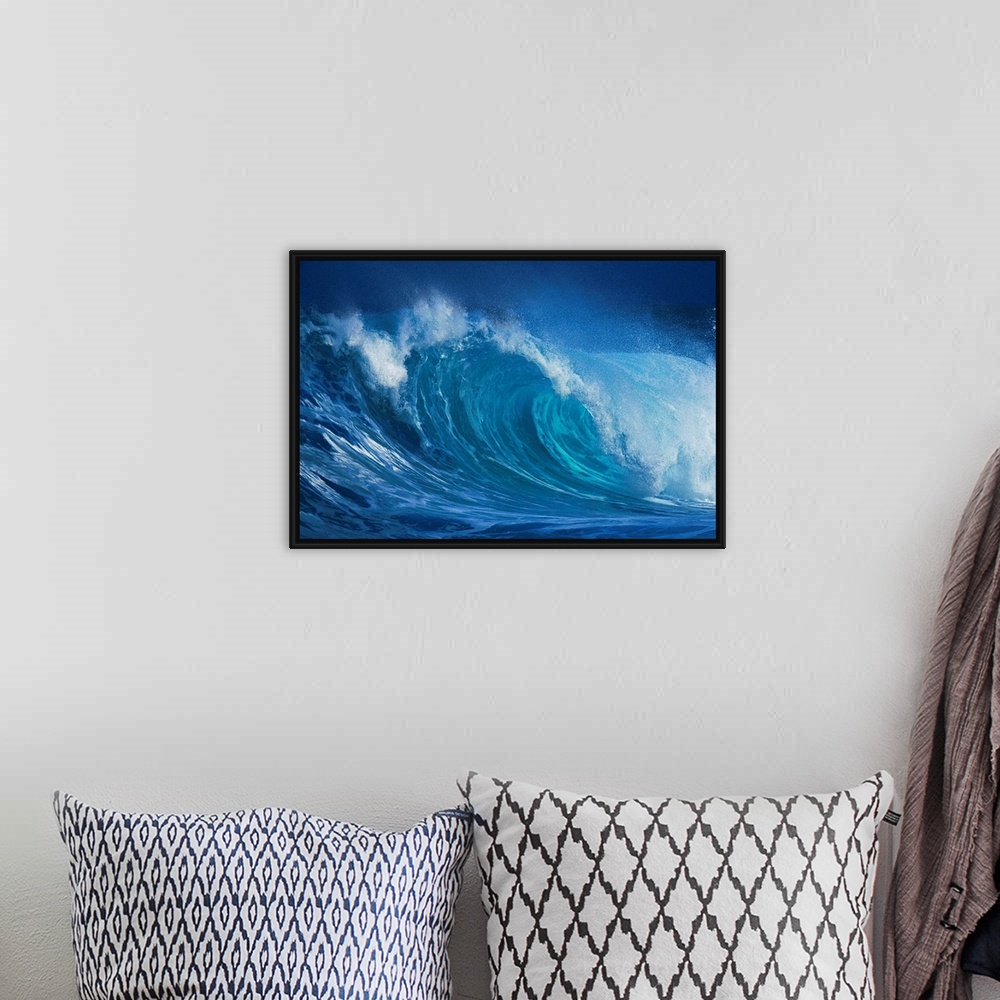 A bohemian room featuring A close up horizontal photograph of a curling wave. During late November through mid-January, the...