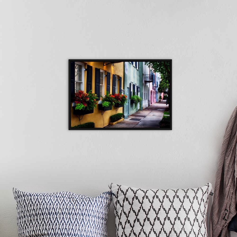 A bohemian room featuring Fine art photo of a shaded alley with colorful buildings in Charles, South Carolina.