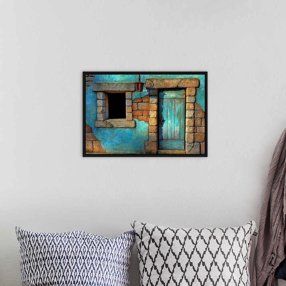 A bohemian room featuring Landscape fine art photograph highlighting a door surrounded by a stone wall and window.