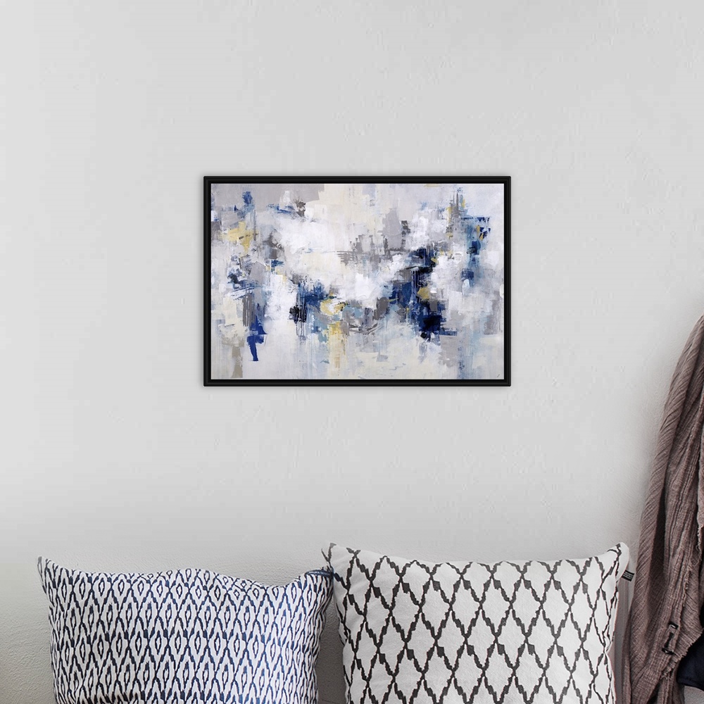 A bohemian room featuring Abstract painting in shades of white and light gray with accents of blue throughout.