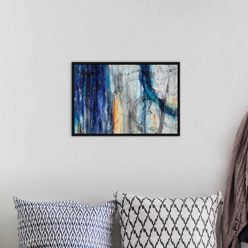 A bohemian room featuring Abstract artwork painted with muted grays and darker blue tones.