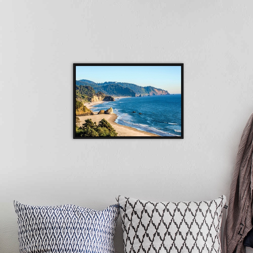 A bohemian room featuring Landscape photograph of the Pacific North West coast at Cannon Beach.