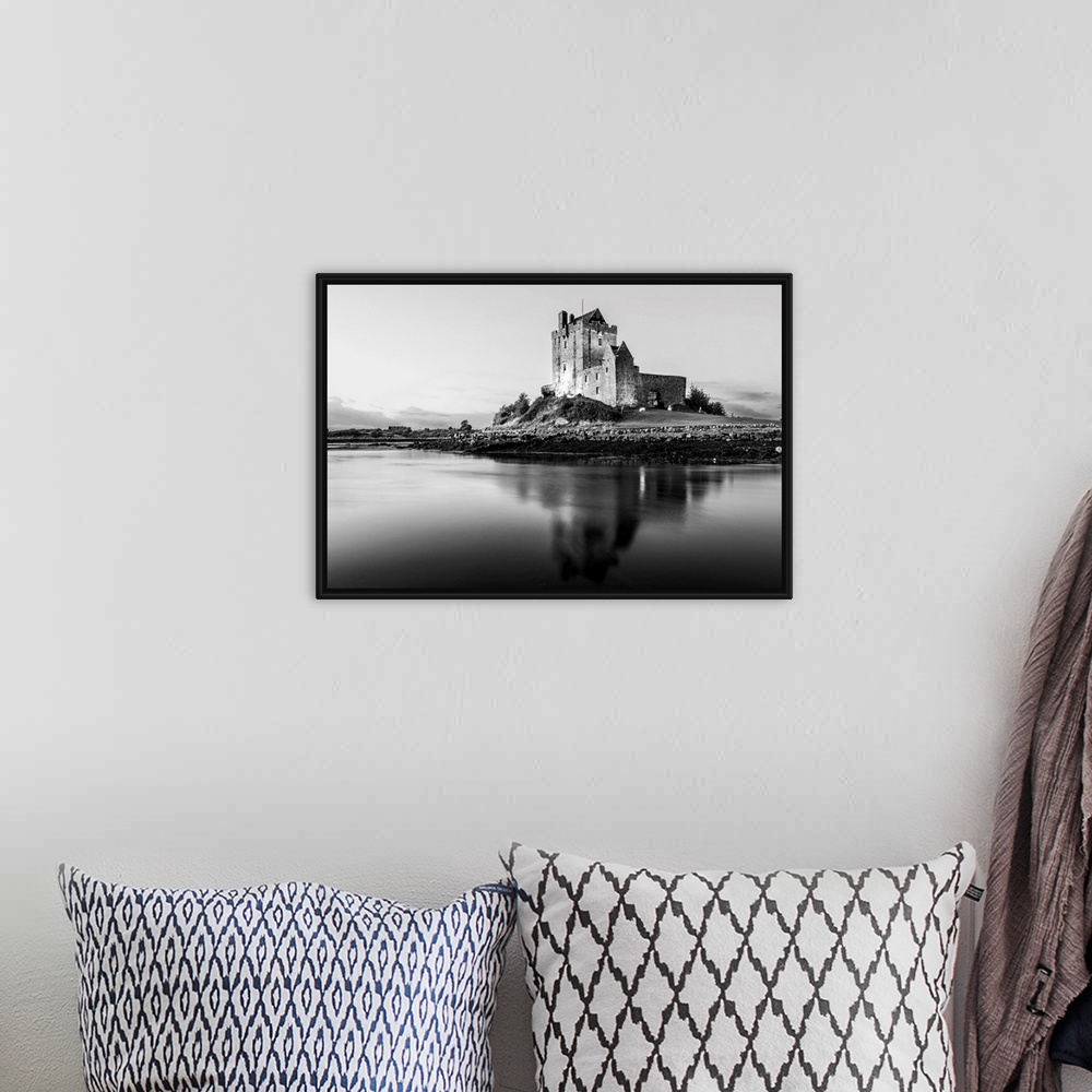 A bohemian room featuring Black and White landscape photograph of the Dunguaire Castle reflecting into the water on the sou...
