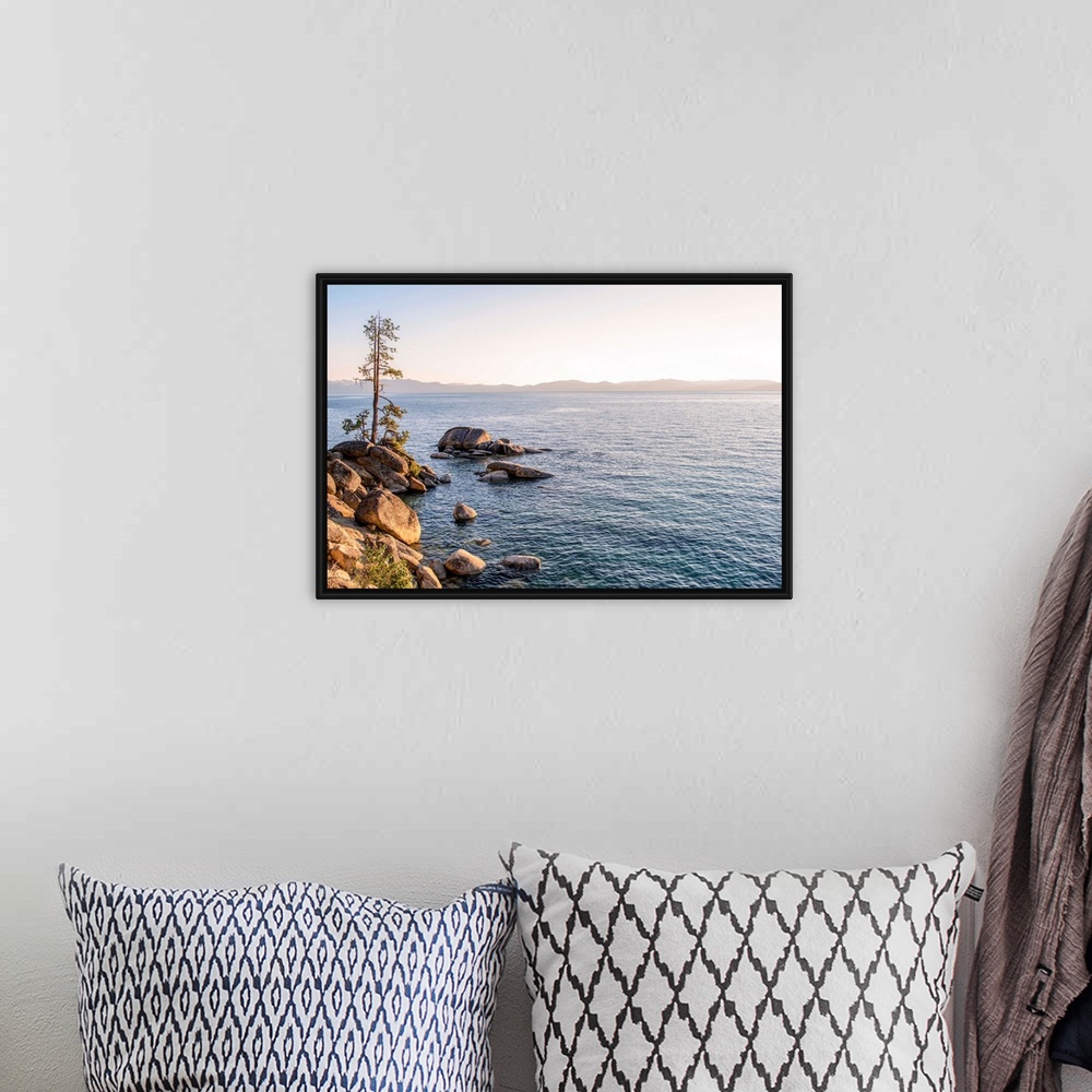 A bohemian room featuring View of Lake Tahoe's rocky shore with mountain landscape in the background in California and Nevada.