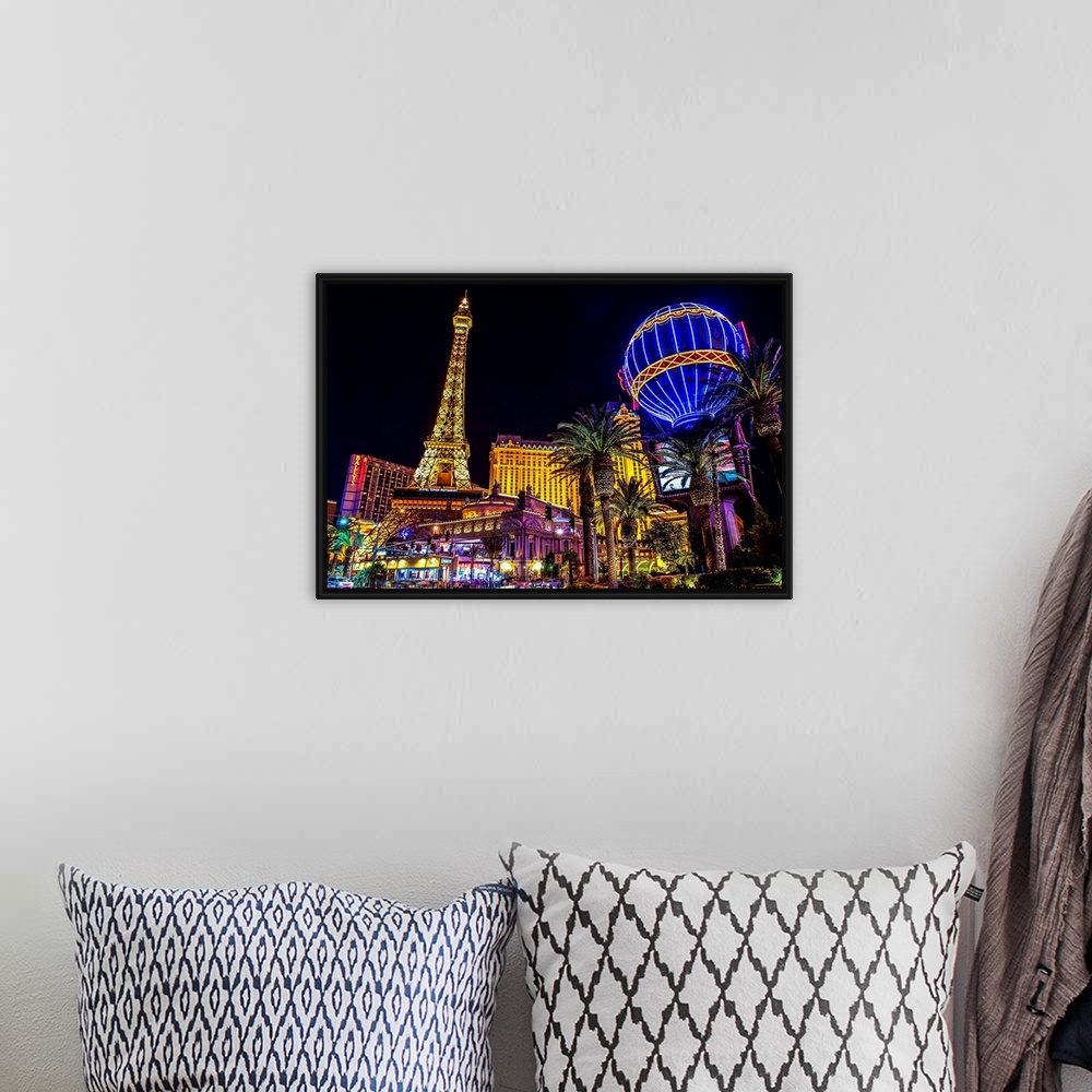 A bohemian room featuring Evening photograph of the Las Vegas strip with the Eiffel Tower and hot air balloon.