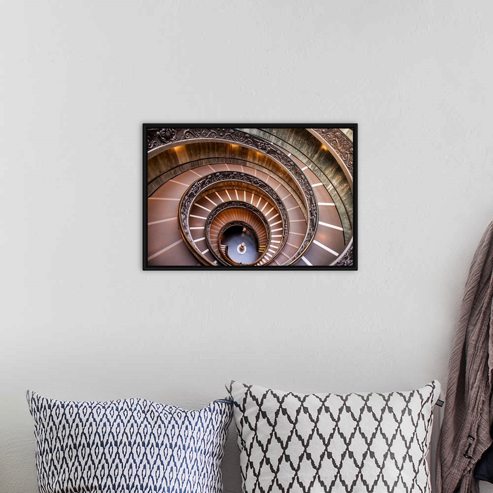 A bohemian room featuring Photograph of the spiral staircase at the Vatican Historical Museum.
