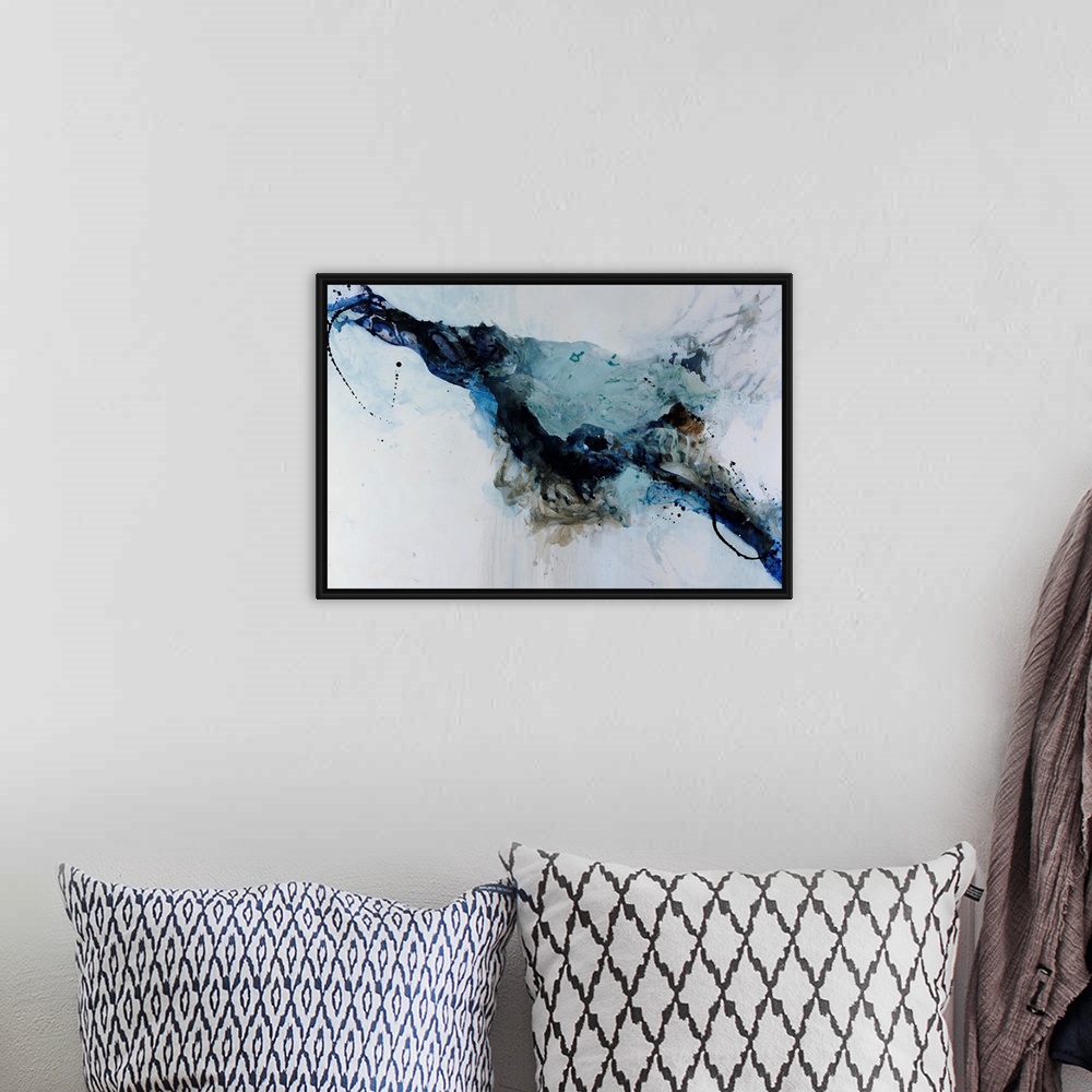A bohemian room featuring Abstract painting in black and blue against a cool gray background.