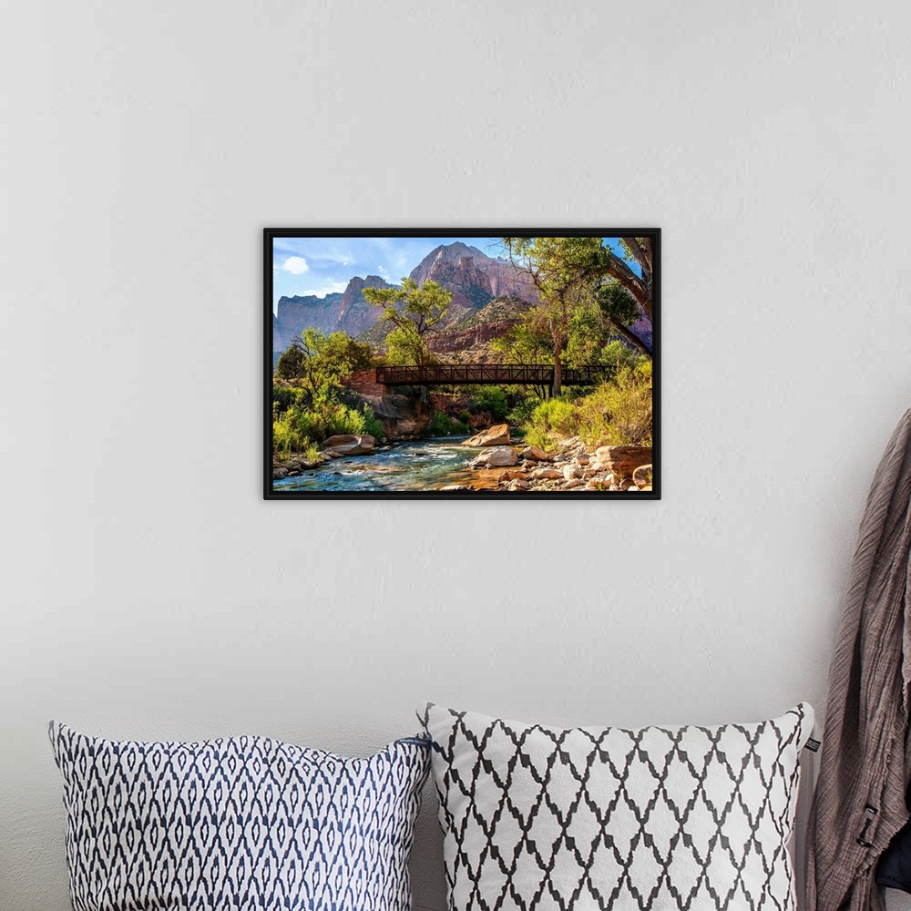 A bohemian room featuring Landscape photograph of a pedestrian bridge over the Virgin River at Zion National Park, UT.