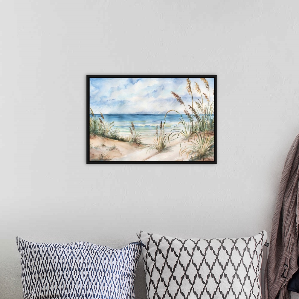 A bohemian room featuring A contemporary watercolor painting of grass cover sand dunes on a beach with a blue sky above.