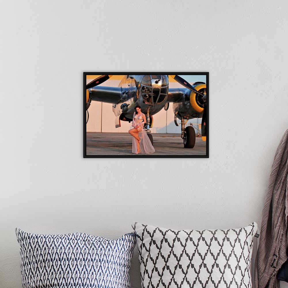 A bohemian room featuring Sexy 1940's pin-up girl in lingerie posing with a B-25 bomber.
