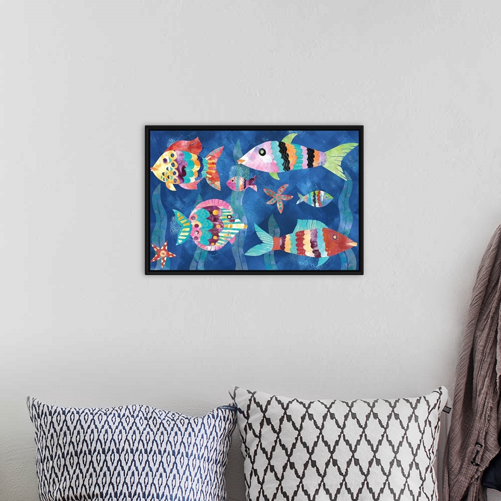 A bohemian room featuring A collage of colorful fish and starfish with seaweed in the background made from mixed media.
