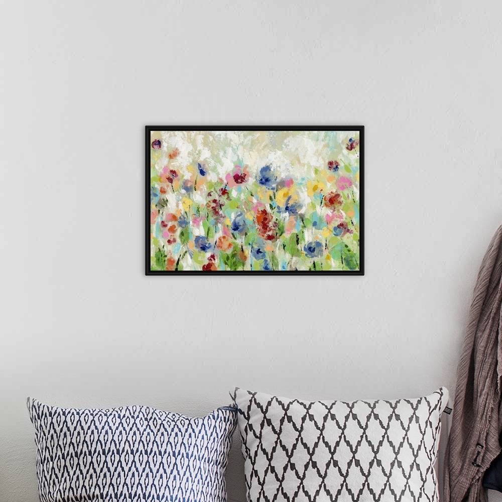 A bohemian room featuring Decorative artwork of whimsical abstract florals in bright colors.