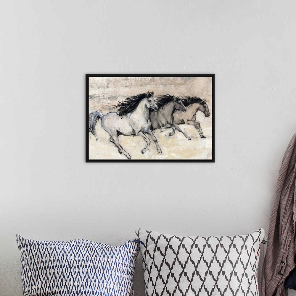 A bohemian room featuring Contemporary artwork of a herd of horses galloping at fast pace.